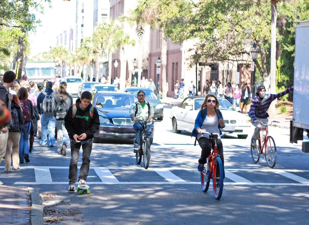 College of Charleston students riding bicycles to class