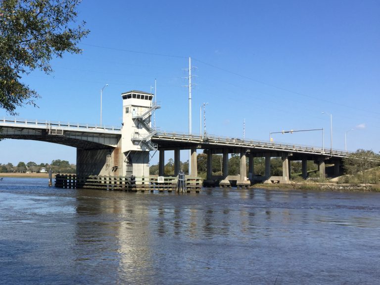 The Wappoo Creek drawbridge spanning the waterway of the Wappoo Cut between Charleston and James Island, with a short control tower near its center.