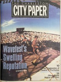 The front cover of an issue of Charleston City Paper reading Wavefest's Swelling Reputation, with an image of a band playing on a stage with an audience in the background
